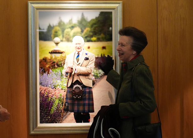 The Princess Royal unveils a new portrait of King Charles III during a visit to the Scottish Parliament at Holyrood