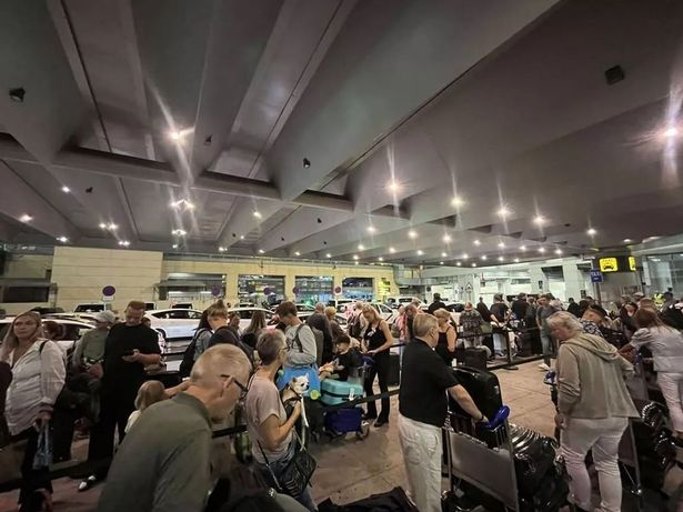 The queue outside the airport after my flight was suddenly cancelled due to a 'disruptive' passenger