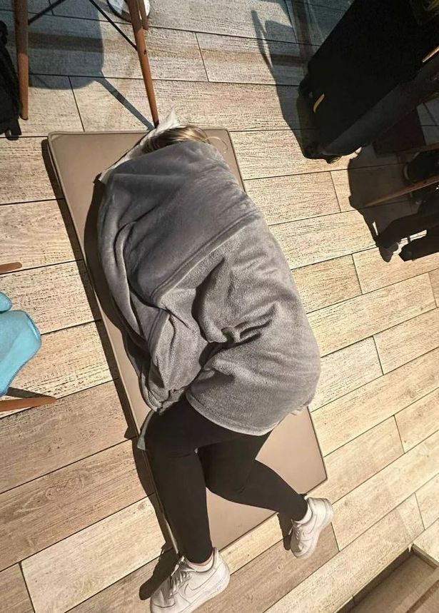 A photo of a passenger resting on the floor