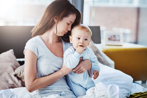 Shot of a mother and her baby boy at home