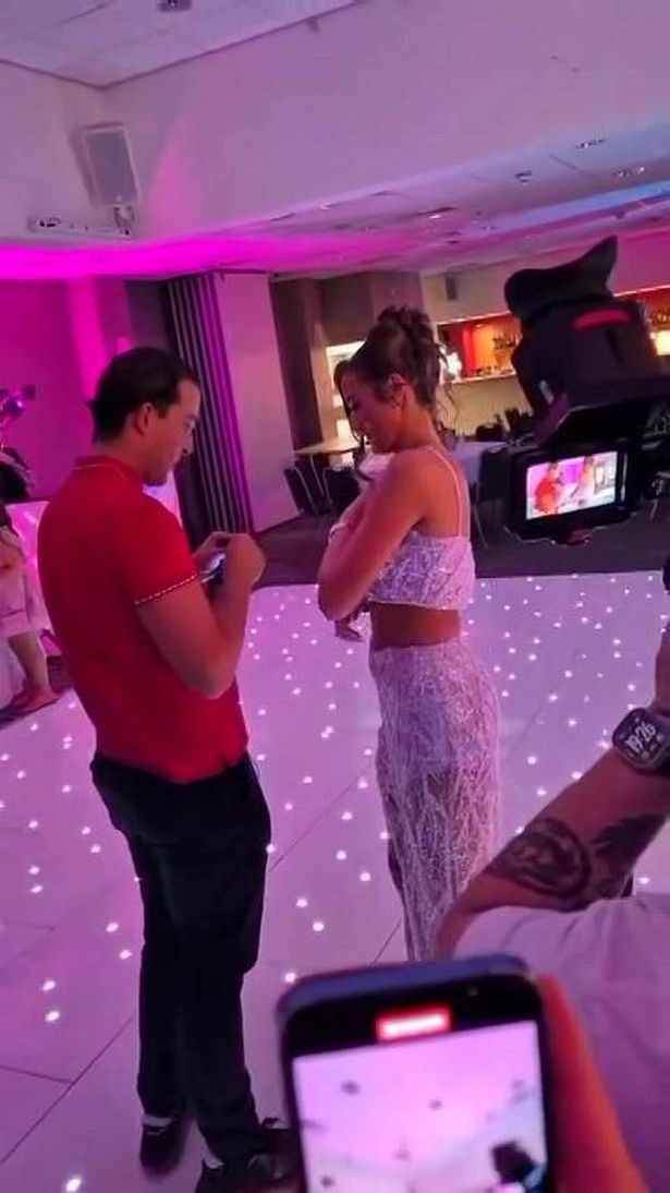 The pair share a sweet moment together before he places a ring on her finger