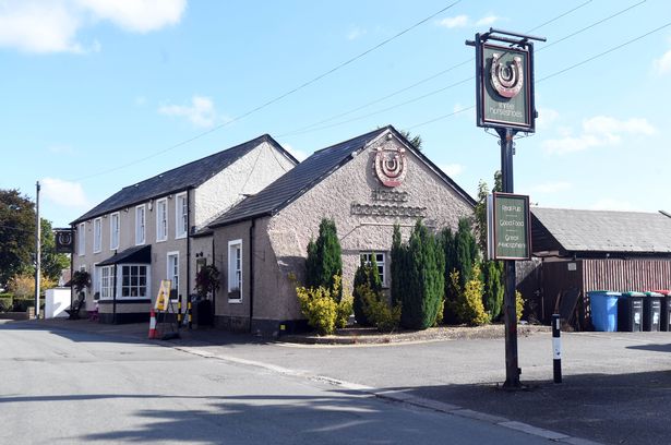 The image shows the quaint if unremarkable village pub which is on the main thoroughfare through the quiet rural village