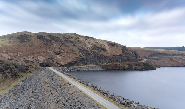 A reservoir against mountains 