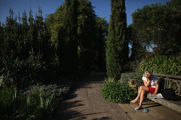 A woman relaxes in the sunshine