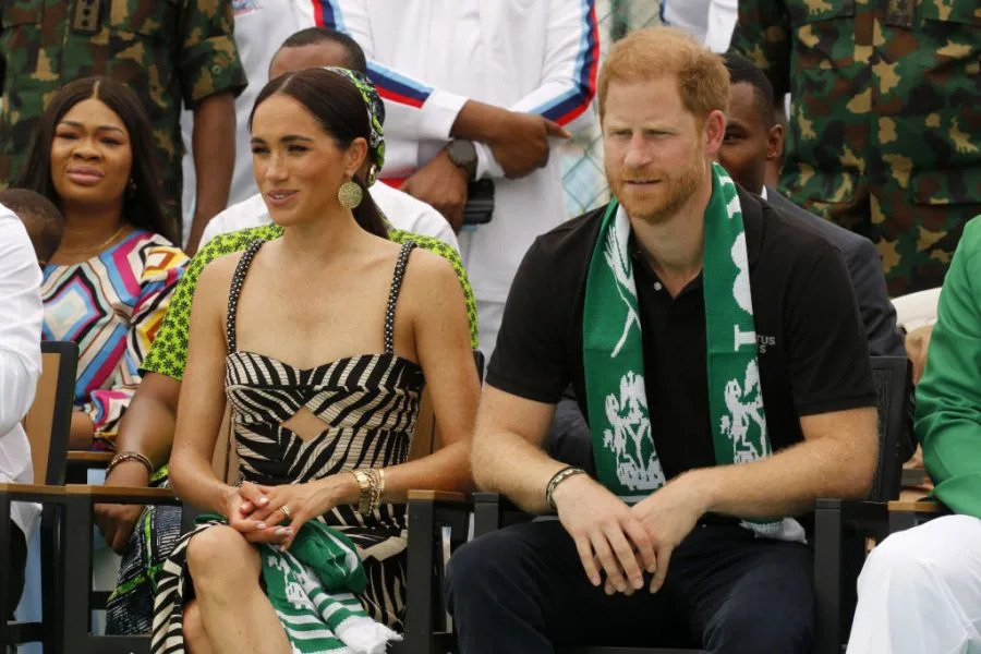 Meghan and Harry watching a volleyball game