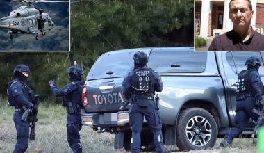 Dramatic night operation gets underway in the hunt for fugitive gunman Dezi Freeman - as officers with guns drawn converge on hillside near Porepunkah