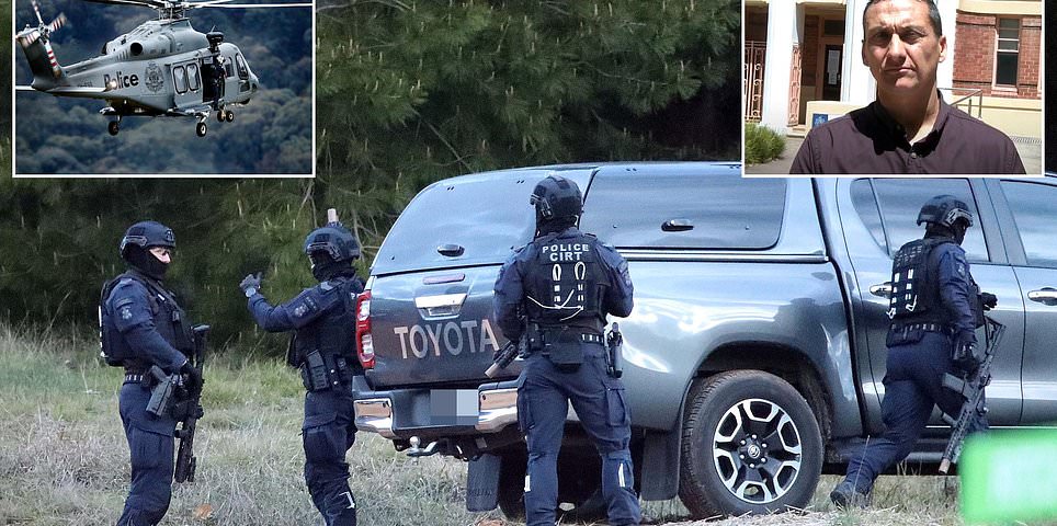 Dramatic night operation gets underway in the hunt for fugitive gunman Dezi Freeman - as officers with guns drawn converge on hillside near Porepunkah