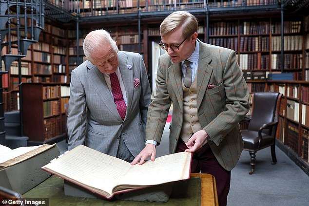 The curator of the Newman Museum, Daniel Joyce, took his time to show Charles the famous texts