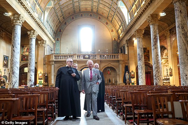 He appeared very cheerful as he was shown around the building by the Archbishop of Birmingham and the Provost of the Birmingham Oratory, Father Ignatius Harrison (left)
