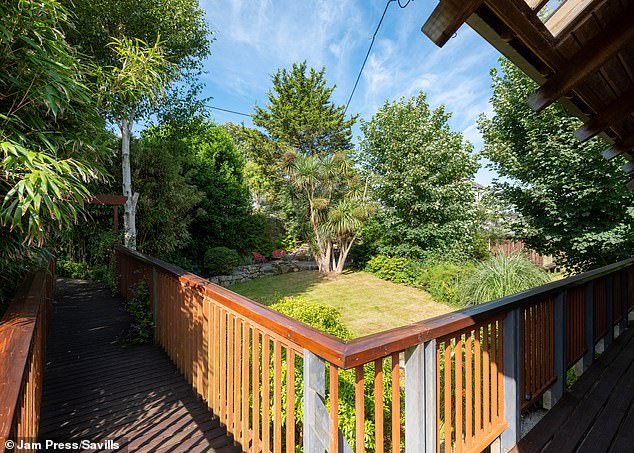 The unique property designed by renowned architect Barrie Briscoe is constructed of birch, pine, cedar and American redwood, atop giant Douglas fir stilts