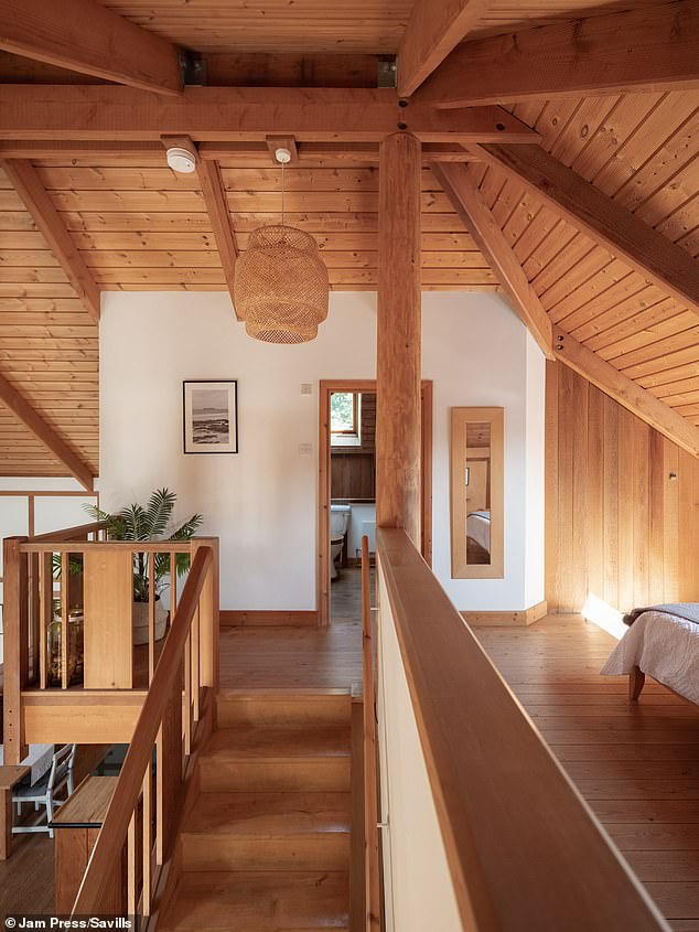 Upstairs, the landing offers an excellent viewpoint overlooking the living space below