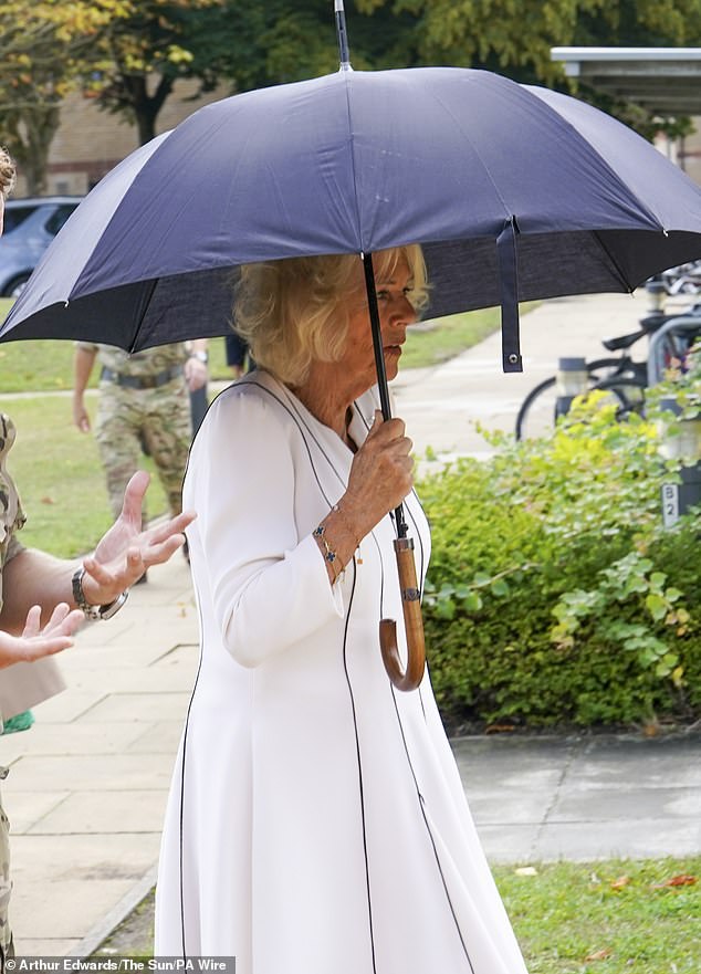 She braved the rain for today's royal engagement in Hampshire