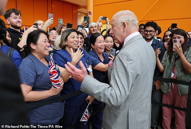 Charles met some supporters who were carrying Union Jack flags