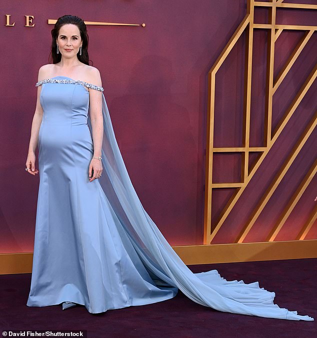 Michelle Dockery, 43, stunned in a gown for the premiere of the third and final film of the period drama in Leicester Square, London