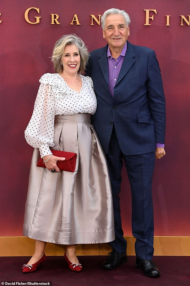 Downton Abbey onscreen couple Phyllis Logan and Jim Carter posed arm in arm on the carpet