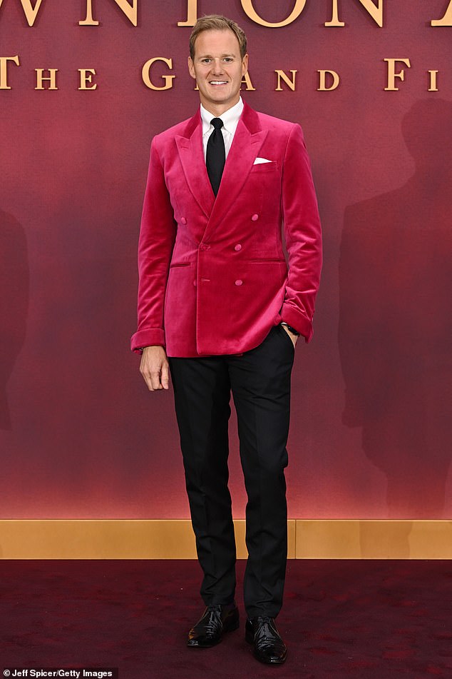 Presenter Dan Walker cut a sophisticated figure in a red velour suit jacket