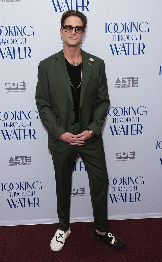 He looked the spitting image of his A-list father as he made a rare public appearance for the New York premiere of Looking Through Water on Wednesday - but can YOU guess who he is?