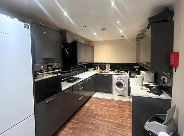 One of the kitchens inside the giant HMO which features an oven and fridge freezer
