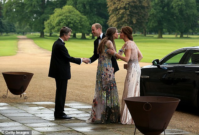 William and Kate are greeted by David Cholmondeley, Marquess of Cholmondeley and Rose Cholmondeley, the Marchioness of Cholmondeley as they attend the gala