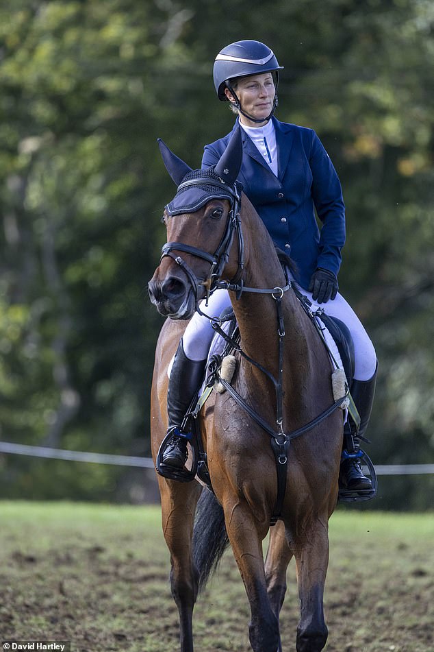 Sporting white jodhpurs, a navy blazer and black boots, she looked graceful while taking part in the day's festivities in Oxfordshire