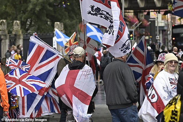 People carrying flags and banners gathered in central London on Saturday