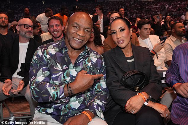 Mike Tyson attends Netflix's Canelo v Crawford Fight Night with his wife, Lakiha Spicer
