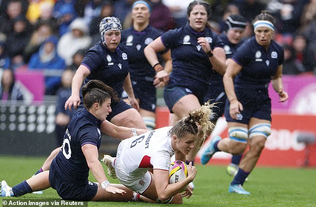 England's Zoe Aldcroft in action with Helen Nelson of Scotland