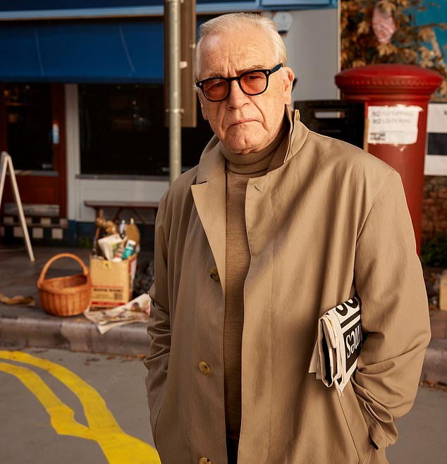 Actor Brian Cox posed in a classic trench coat by luxury raincoat makers Mackintosh