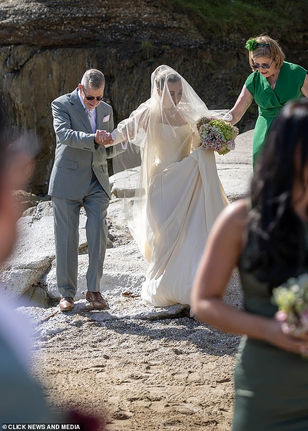 Becky's parents helped her down some perilous rocks