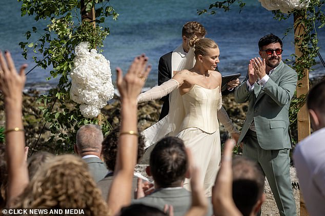 Her corseted gown made the most of her svelte waist