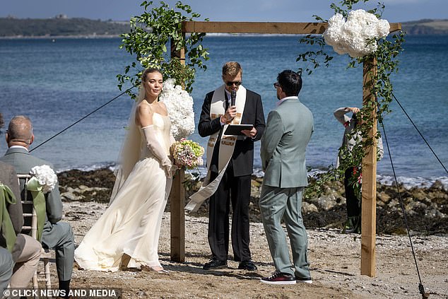 She looked radiant for the stunning scenes as she wed her love of a decade