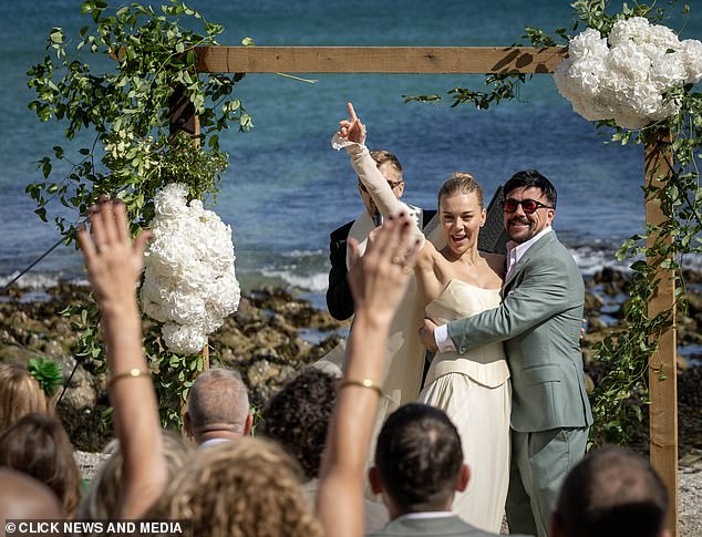 The couple celebrated their big moment by turning to the crowd