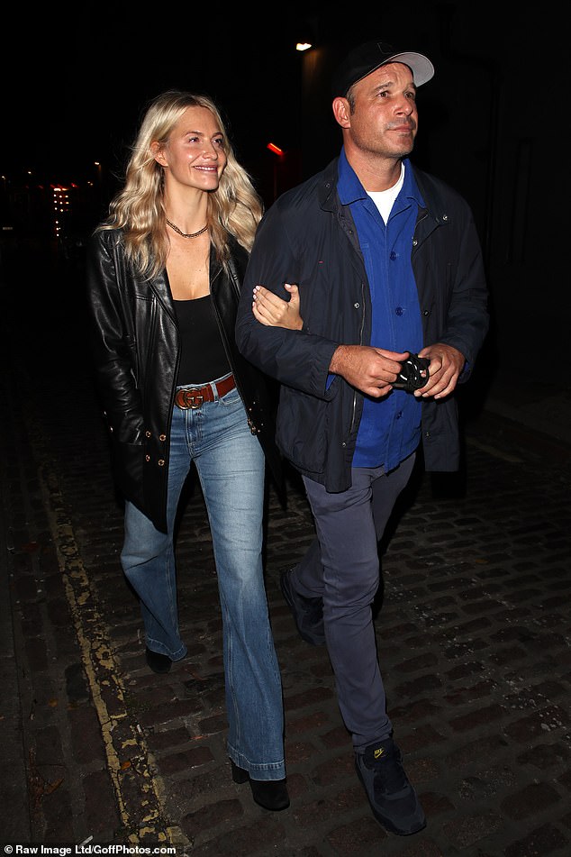 New mum Poppy Delevingne donned flared jeans and a low-cut black vest that she paired with a leather jacket