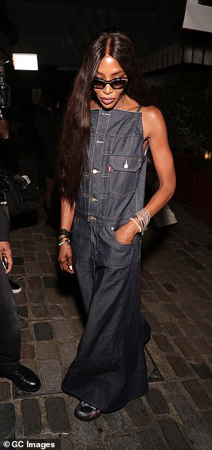 Naomi looked effortlessly stylish in Levis' denim maxi dress that boasted a quirky bodice which she wore with comfy trainers