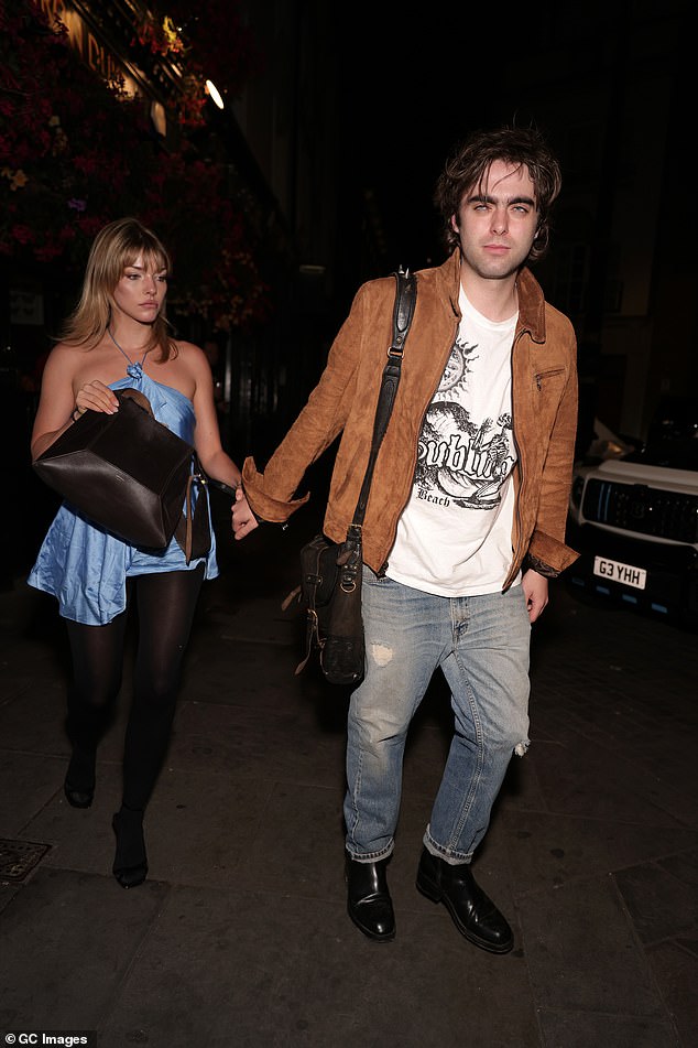Meanwhile Lennon was every inch the rocker in jeans and a suede jacket