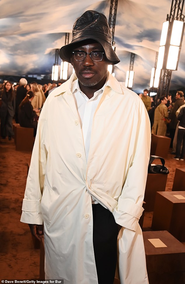 While Edward cut an quirky figure in a trendy waterproof jacket, chunky white trainers and a leather bucket hat