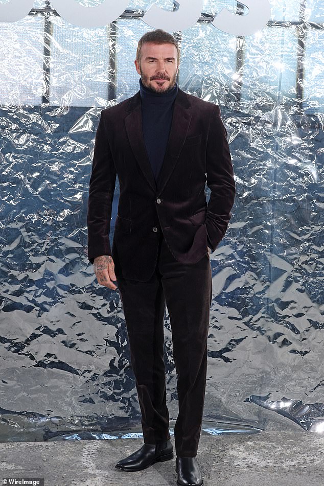 He cut a dapper figure in a brown velvet blazer and tailored trousers as he joined Hugo Boss' CEO, Daniel Grieder at the runway presentation (seen)