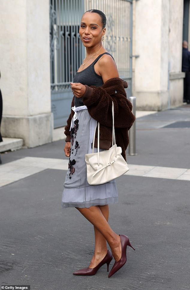 The Scandal star teamed her outfit with a fuzzy brown jacket, a white handbag and burgundy leather heels