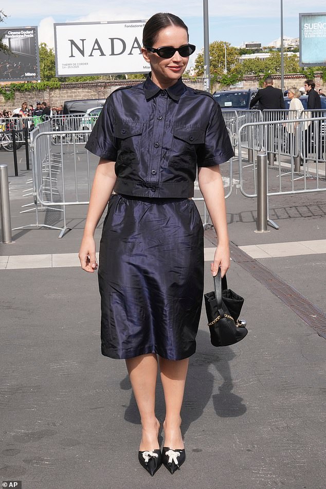 The Brutalist star accessorised her look with black pointed-toe heels with a white bow detailing, and a simple black handbag