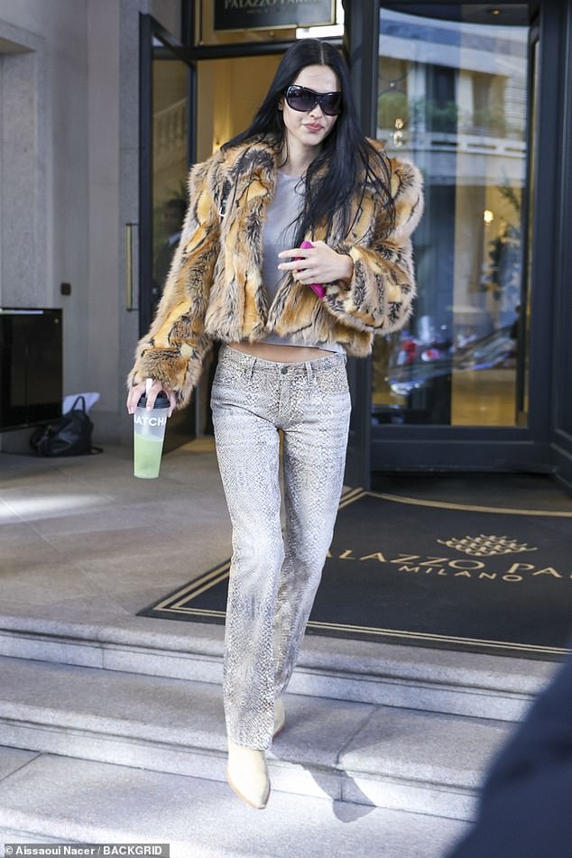 In between shows, Amelia was spotted heading out in Milan on Thursday, as she managed to pack in a whopping three runways in one day