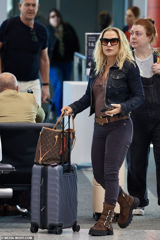 Anastacia put on a stylish display, wearing her trademark coloured-lens glasses, layered necklaces, a statement leather belt and matching buckle-up boots