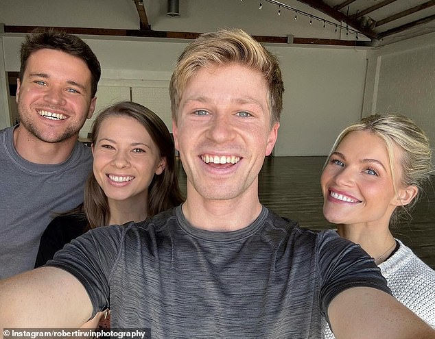 The lookalike siblings looked chuffed to be hanging out as Bindi and her husband Chandler Powell took photos with her brother and his dance partner Witney Carson, 31