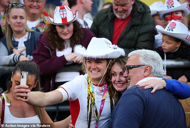 The star of her teammate Ellie Kildunne (pictured celebrating Saturday's win with her parents Nigel and Alison Kildunne) is also on the rise - only further shown after the fullback, 26, scored the first try in Saturday's game
