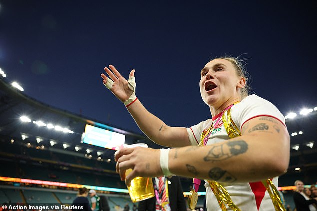 England's Megan Jones celebrates winning the final at Twickenham