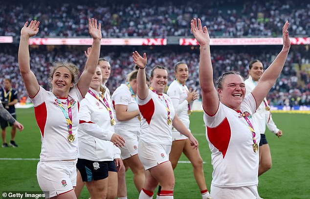 Abby Dow and Sarah Bern of England wave to fans after the match