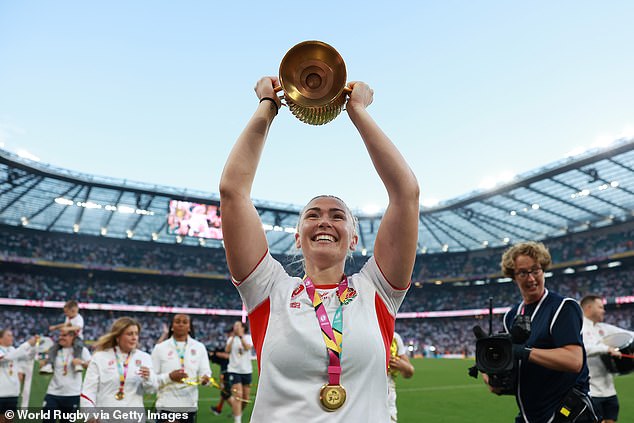 Rosie Galligan of England holds the Women's World Cup Trophy