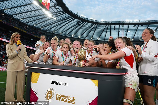 The Red Roses celebrate as they are interviewed by BBC Sport's Gabby Logan following victory