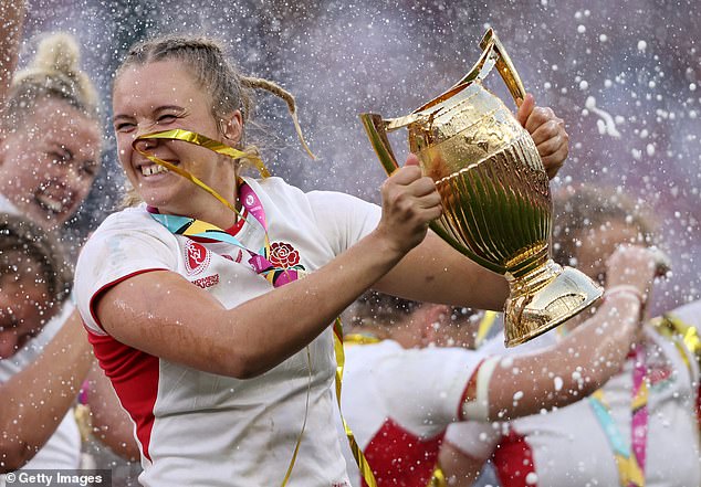 Zoe Aldcroft of England celebrates with the World Cup Trophy