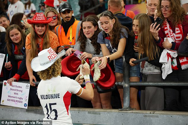 England's Ellie Kildunne signs autographs for fans after winning the final