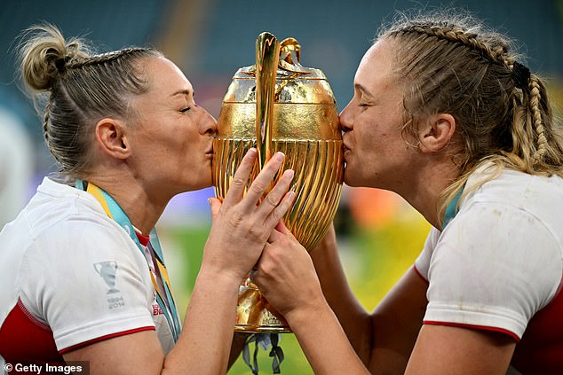 Natasha Hunt and Zoe Aldcroft of England kiss the trophy as they celebrate victory